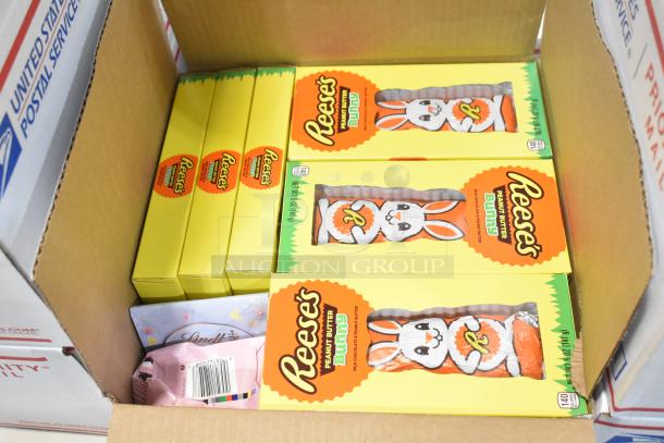 10 boxes of assorted candies including Reese's Peanut Butter Bunny, Jef Puffed Marshmallows, in an open USPS priority mail box.