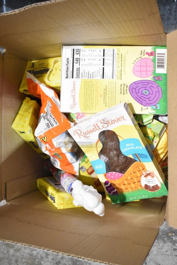 Box with assorted candies: Russell Stover chocolate bunny, Peeps, Reese's, Junior Mints. Includes nutrition labels.