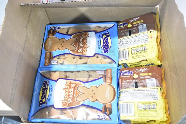 Box of mixed candies including Peeps Chocolate Pudding Flavored Marshmallows and Peeps Delights. Various brands included.