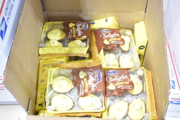 10 boxes of assorted candy including Peeps Delights Marshmallow chicks in chocolate, shown in original packaging.