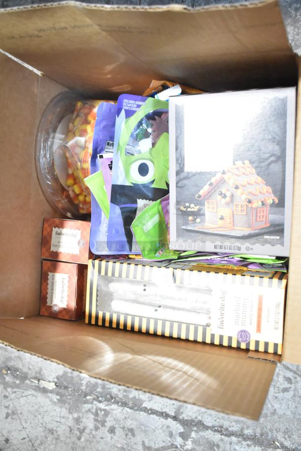 Box of assorted candy with chocolate bunny, Wednesday Kellogs cereal, Jet Puffed marshmallows, Haribo sour Easter grass.