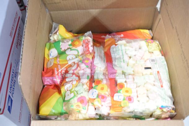Box of assorted candies including Jet Puffed marshmallows, visible packaging, colorful design. Auction lot of 10 boxes.