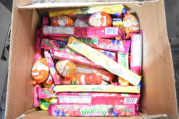 Box with Mamba Berrytastic candy, Kinder Joy, variety of sweet treats, labeled packaging, assorted well-kept candies.