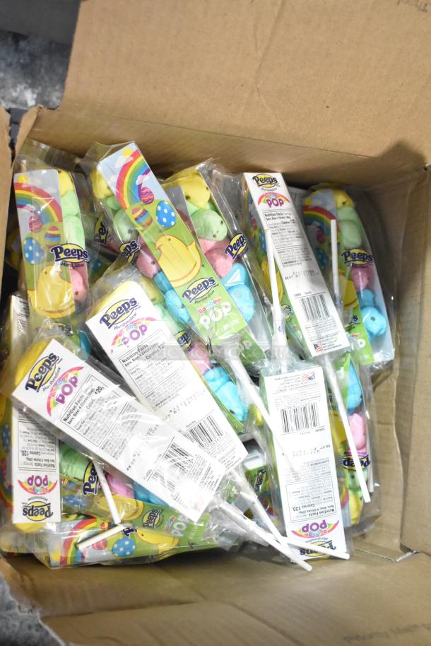Cardboard box filled with Peeps Marshmallow Pops. Colorful packaging with nutrition labels visible. Ideal for candy lovers.