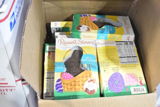 Box of Russell Stover milk chocolate bunnies, with colorful packaging and nutrition label visible. Mint condition.