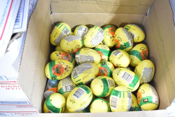 Box of Reeses candy in yellow packaging, part of 10-box auction including Peeps and chocolate bunnies.