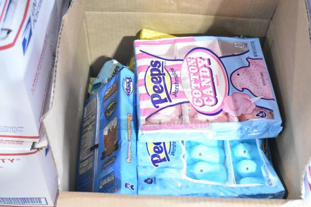 10 boxes of candy featuring Reeses and Peeps including cotton candy and chocolate bunnies varieties.