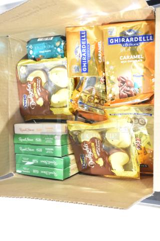 Box of assorted candy including Ghirardelli caramel bunnies, Peeps Delights, and Russell Stover chocolates.