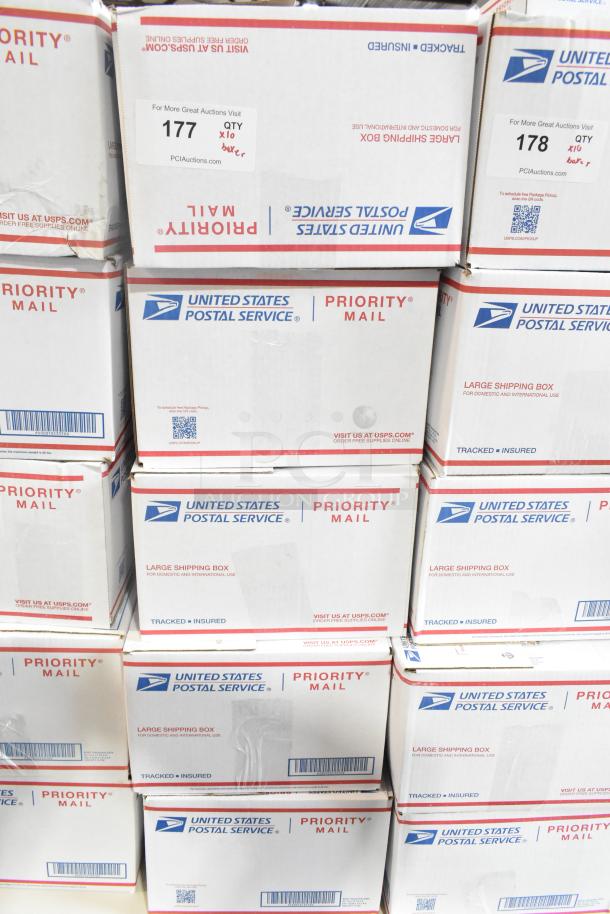 10 USPS Priority Mail boxes for auction, labeled with candy contents: chocolate bunnies, crosses, Peeps, jellybeans.