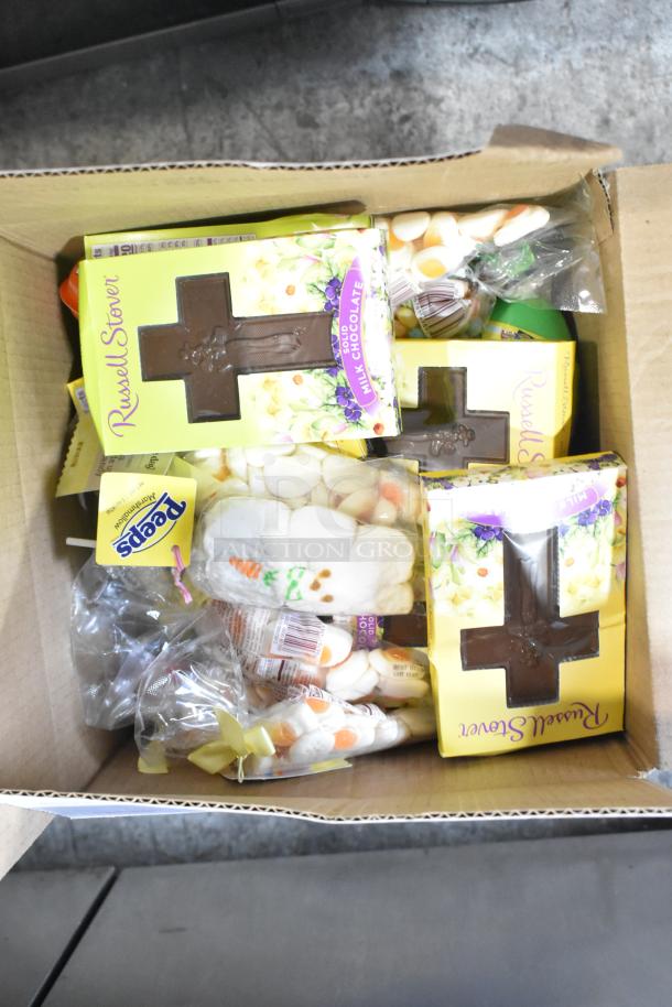 Box containing Russell Stover chocolate crosses, Peeps cotton candy, and assorted candies; 10 times your bid.