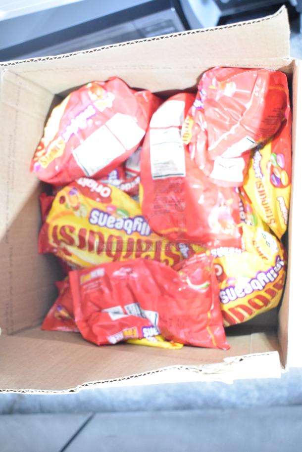 Box containing multiple bags of Starburst Jellybeans. Part of a lot with chocolate bunnies, crosses, and Peeps.