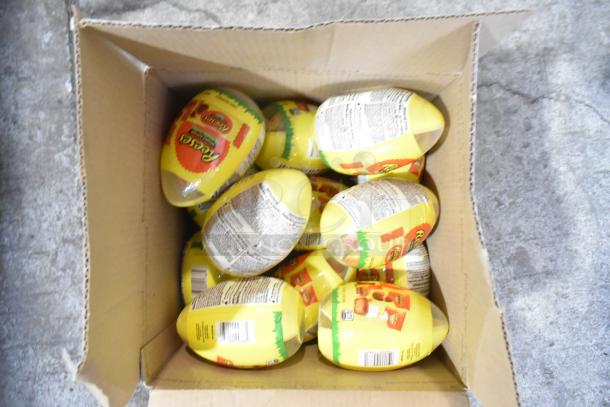 Box of Reese’s Pieces eggs, unopened, highlighting candy in auction lot of 10 boxes, includes Junior Mints, Kinder Joy, Kisses, Peeps.