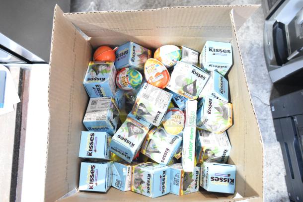 Box with 10 assorted candy boxes: Junior Mints, Kinder Joy Eggs, Kisses, Yellow Peeps. Auction lot, 10 times your bid.