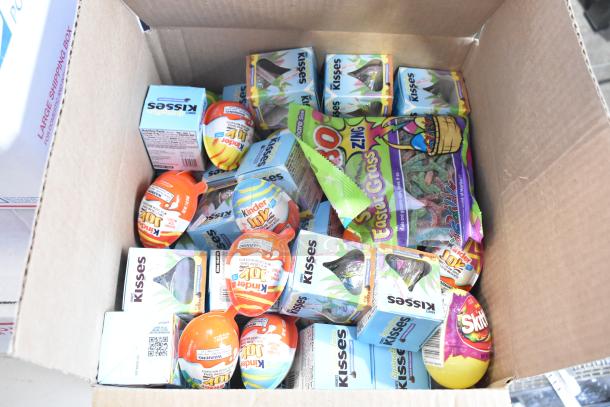 Box of assorted candy, including Junior Mints, Kinder Joy Eggs, Kisses, Yellow Peeps, Skittles. 10 times bid offer.