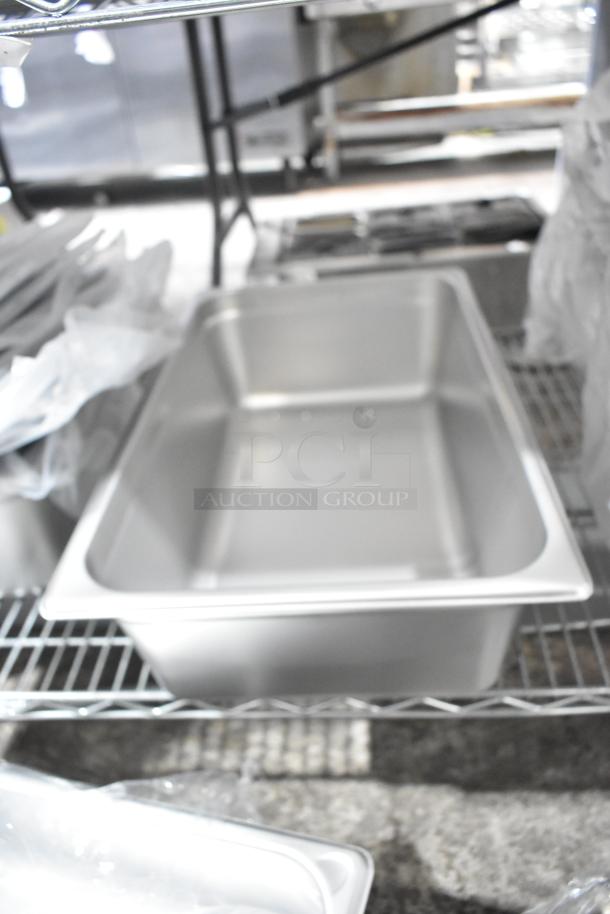 29 scratch and dent kitchen items, including Choice 407OPL ladles and Vigor stainless steel bins, on wire shelving.