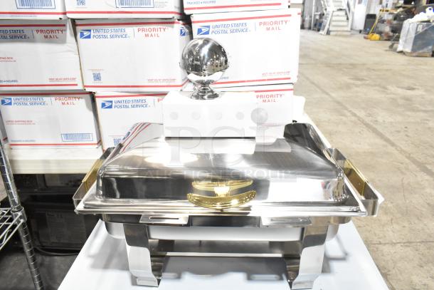 Brand new scratch and dent chafer, stainless steel, reflective finish, visible gold accents, slight blemishes noted.