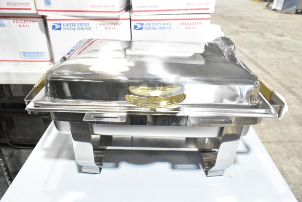 BRAND NEW SCRATCH AND DENT chafer with stainless steel finish, gold handles, minor blemishes; perfect for catering events.
