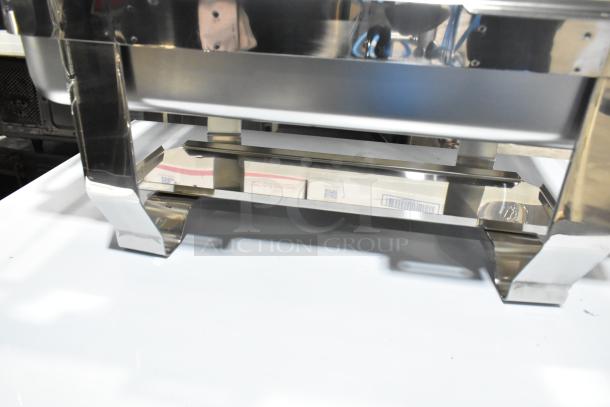 "Brand new stainless steel chafer with minor scratches. Durable construction, ideal for catering. Scratch and dent sale."