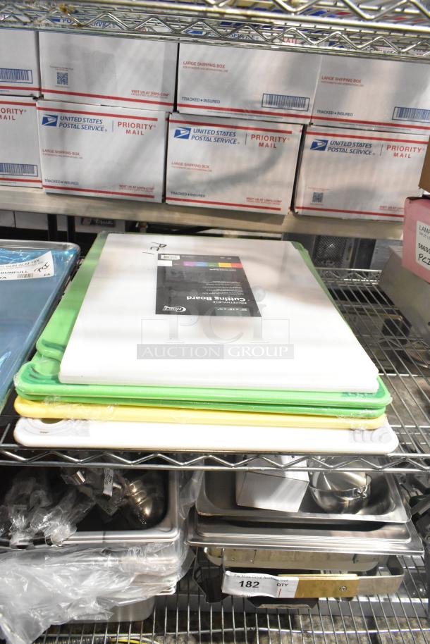 Brand new scratch and dent items: assorted baking pans and colorful cutting boards on metal shelving.