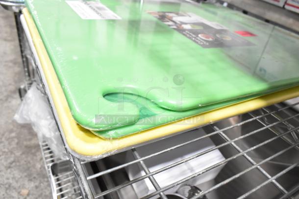 Green and yellow cutting boards stacked on a metal shelf, in brand new condition with some visible packaging.