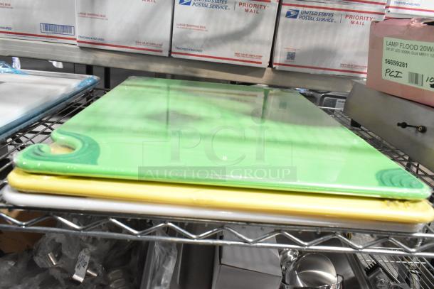 Eight new scratch and dent items on a wire shelf, including assorted colored cutting boards.