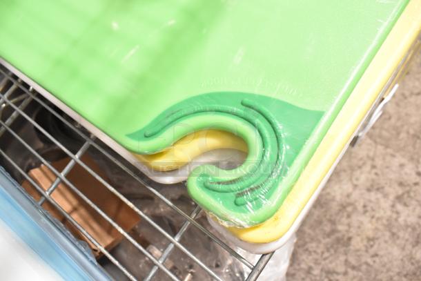 Set of colorful cutting boards, new condition, visible scratch and dent in packaging. Includes green, yellow, and white boards.