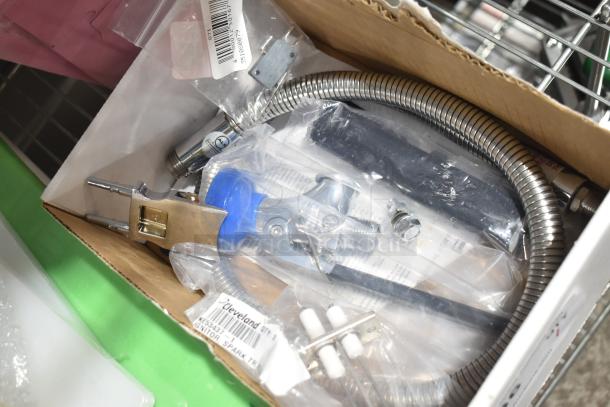 Brand new Cleveland KE53437-1 spark igniter, scratch and dent condition, in original packaging with parts and label visible.