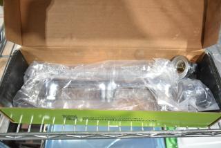 Brand new Regency 600FWM812 wall mount faucet, 8" centers, 12" swing spout, slight scratches; in original packaging.