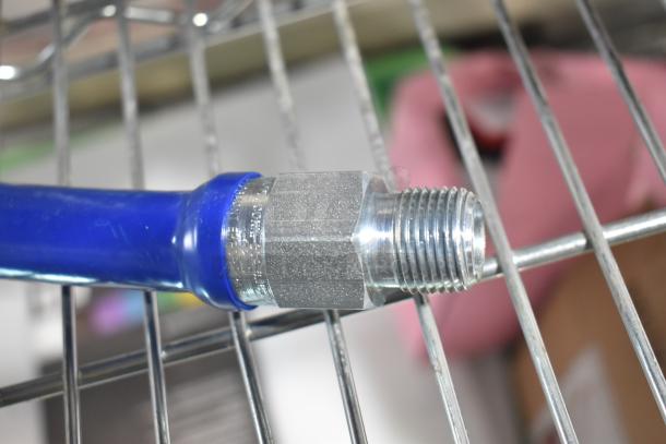 BRAND NEW Dormont gas hose, blue, with accessories. Scratch and dent condition. Visible metal connector detail.