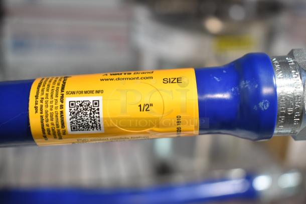 BRAND NEW Dormont gas hose with accessories, 1/2" size, minor scratches, visible yellow label for details.