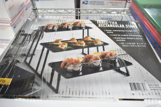 Brand new American Metalcraft ISP18 3-Tier Black Rectangular Riser Stand in box; scratch and dent condition, 20" x 13-3/4" x 12".