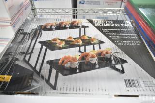 Brand new American Metalcraft ISP18 3-Tier Black Rectangular Riser Stand in box; scratch and dent condition, 20" x 13-3/4" x 12".