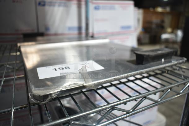 BRAND NEW SCRATCH AND DENT Troy Hill Center Hinge Lid, visible number 198 tag, minor edge damage, metal construction.