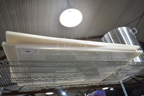 5 new scratch and dent items: 471SP60QT Choice 60 Qt. aluminum stock pot, 4 white cutting boards. Tags indicate quantity five.