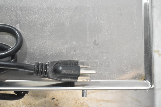 BRAND NEW SCRATCH AND DENT ServIt ENSSW4820, 48" stainless steel heated shelf warmer with visible cord and plug.