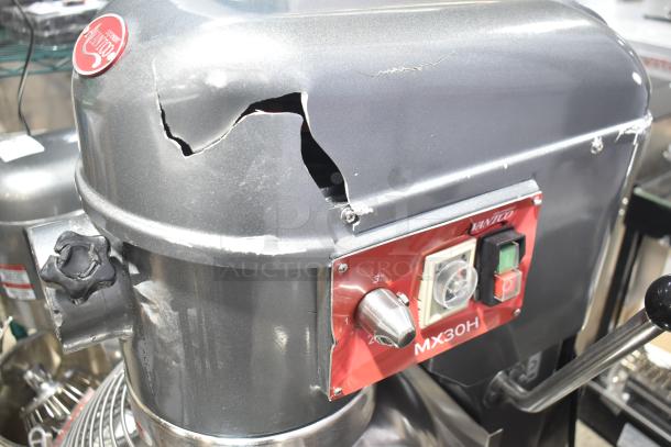 Brand new Avantco 177MX30H commercial 30-quart dough mixer with visible dent on top, includes mixing bowl and attachments.