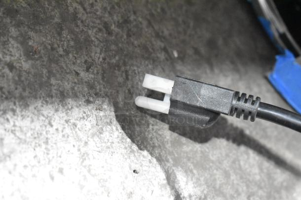 Black electrical plug and cable on a textured surface, likely part of the Avantco 177MX30H mixer mentioned in item details.