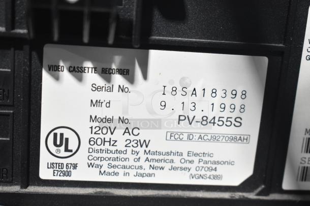 Label on Panasonic PV-8455S VHS Player indicating serial number I8SA18398, manufactured 09.13.1998, 120V AC, 60Hz, 23W.