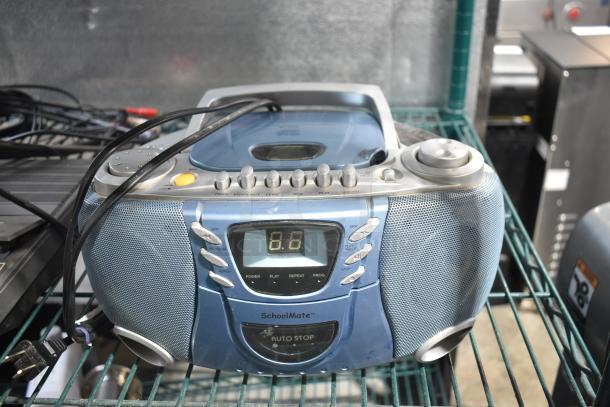SchoolMate SC-5050 CD Player with auto stop feature, digital display, and audio controls on a metal shelf.