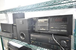 7 electronic items including Pioneer PD-F606 CD player, Pioneer VSX-305 receiver, Philco VHS player, and Pioneer speakers on a shelf.