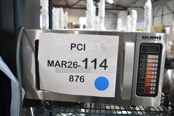 Like new Solwave EM025FJT-S0SA00 stainless steel commercial microwave, model 180MW1000SS, with push button controls.