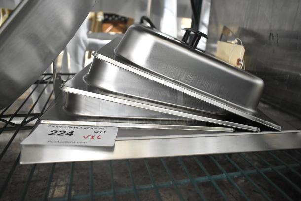 Alt text: "Set of six new scratch and dent kitchen items, including Pitco P6072125 basket, skillets, and lids, on metal shelf."