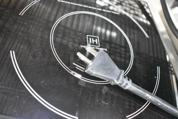 BRAND NEW Avantco 177IC3500 countertop induction range, 208-240V, showing a plug and heating zone on glass surface.