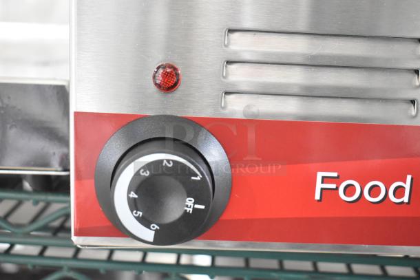 Avantco 177W50 electric countertop food warmer, scratch and dent, features temperature dial and stainless steel design.