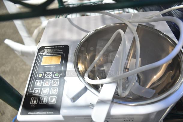 BRAND NEW SCRATCH AND DENT! ChocoVision Revolation 2 tempering machine, 1.5 lb. capacity, 110V, visible display and controls.