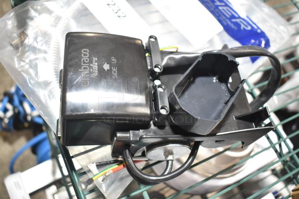 2 new scratch and dent items: Fisher 2914 36" pre-rinse hose and Embraco Nidec unit, side up indication visible.