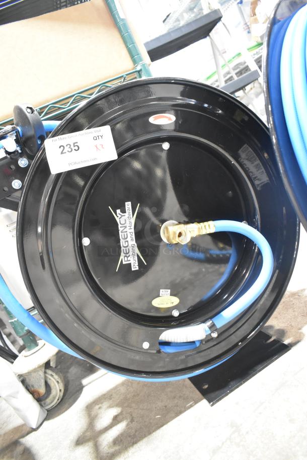 Brand new Regency powder-coated steel air hose reel with hose, minor scratches, labeled for auction lot 235.