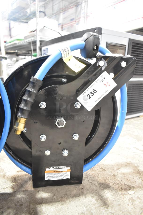 Brand new Regency open powder-coated steel air hose reel with hose, featuring durable black finish.