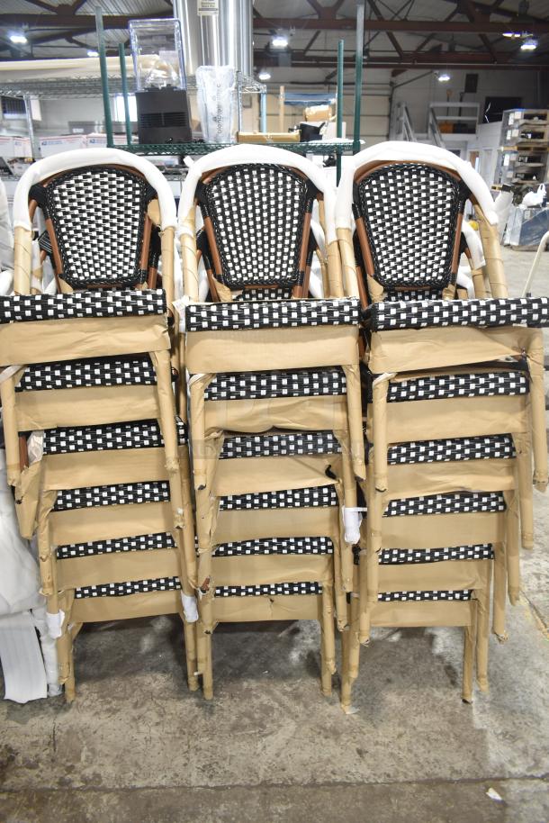 18 new Lancaster Table & Seating bistro chairs, black and white checkered weave, rattan outdoor, scratch and dent condition.