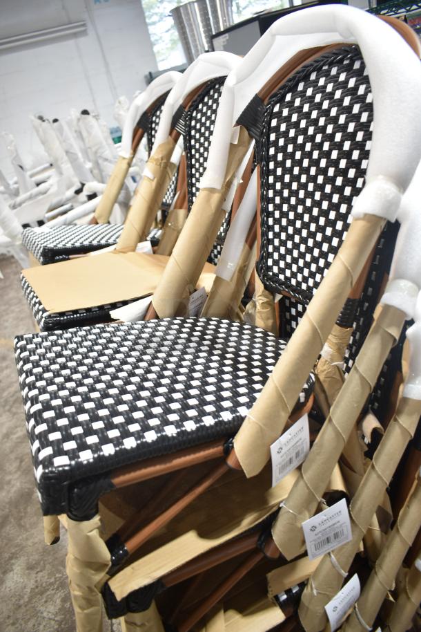 18 new Lancaster Table & Seating bistro chairs, black and white checkered weave, rattan, labeled, scratch and dent condition.